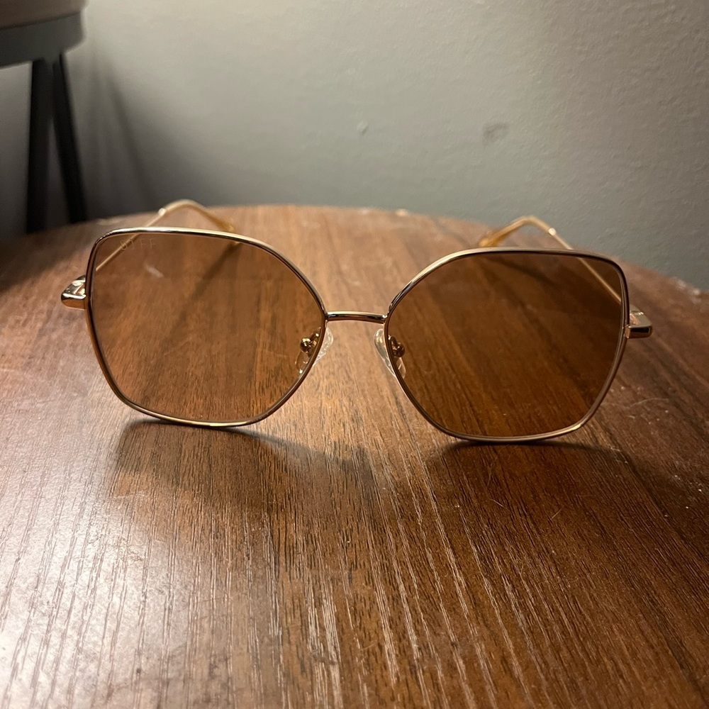 Gold Sunglasses with Hexagonal Lenses and Thin Metallic Frame